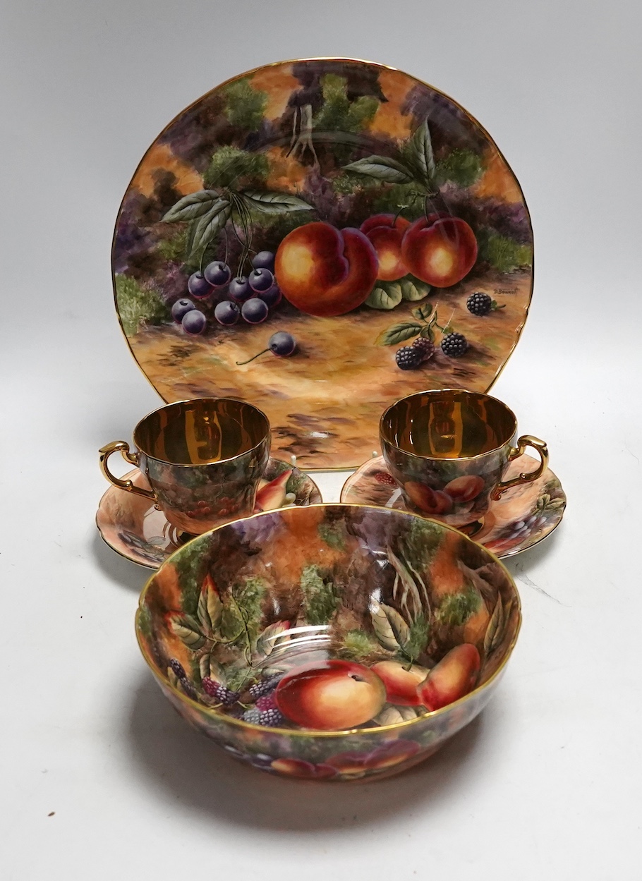 A tea set painted with still life of fruit, Studio D.R.B., comprising six cups and saucers, two bowls and two plates
